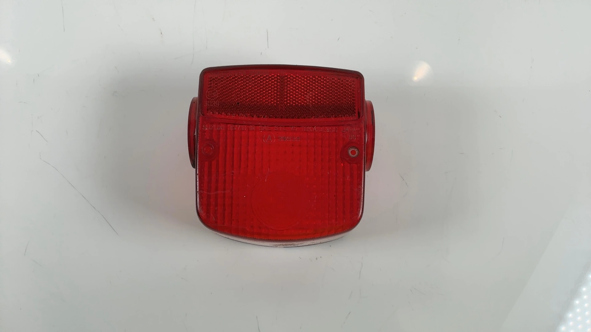 Suzuki TS250 250cc Rear Brake Light Lens 1973-1977 OEM 35712-38350 - Image 1