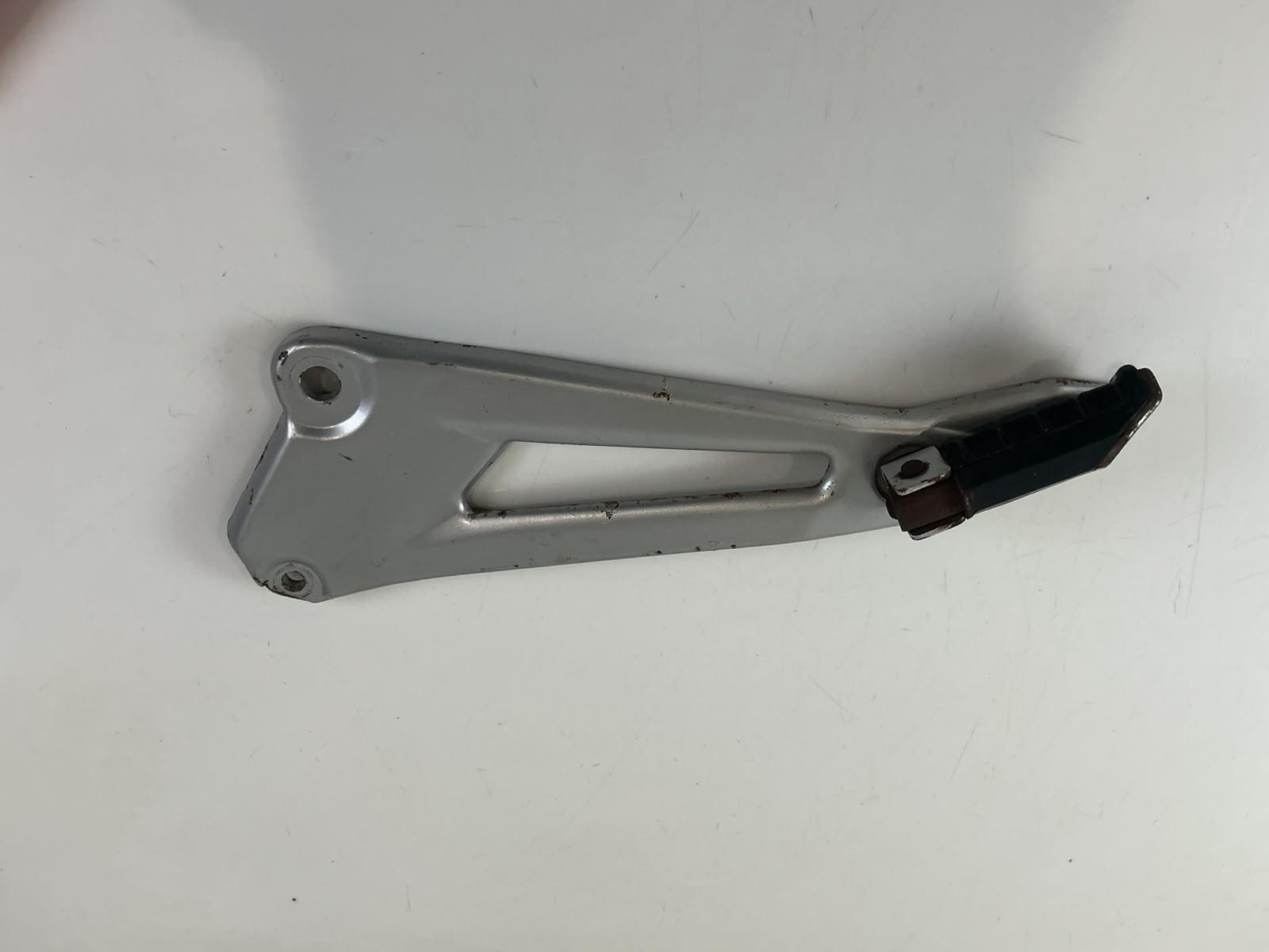 Yamaha YBR 125 YBR125 Left Rear Foot Peg Bracket Mount 2005-06 OEM 5VL-F7452-00