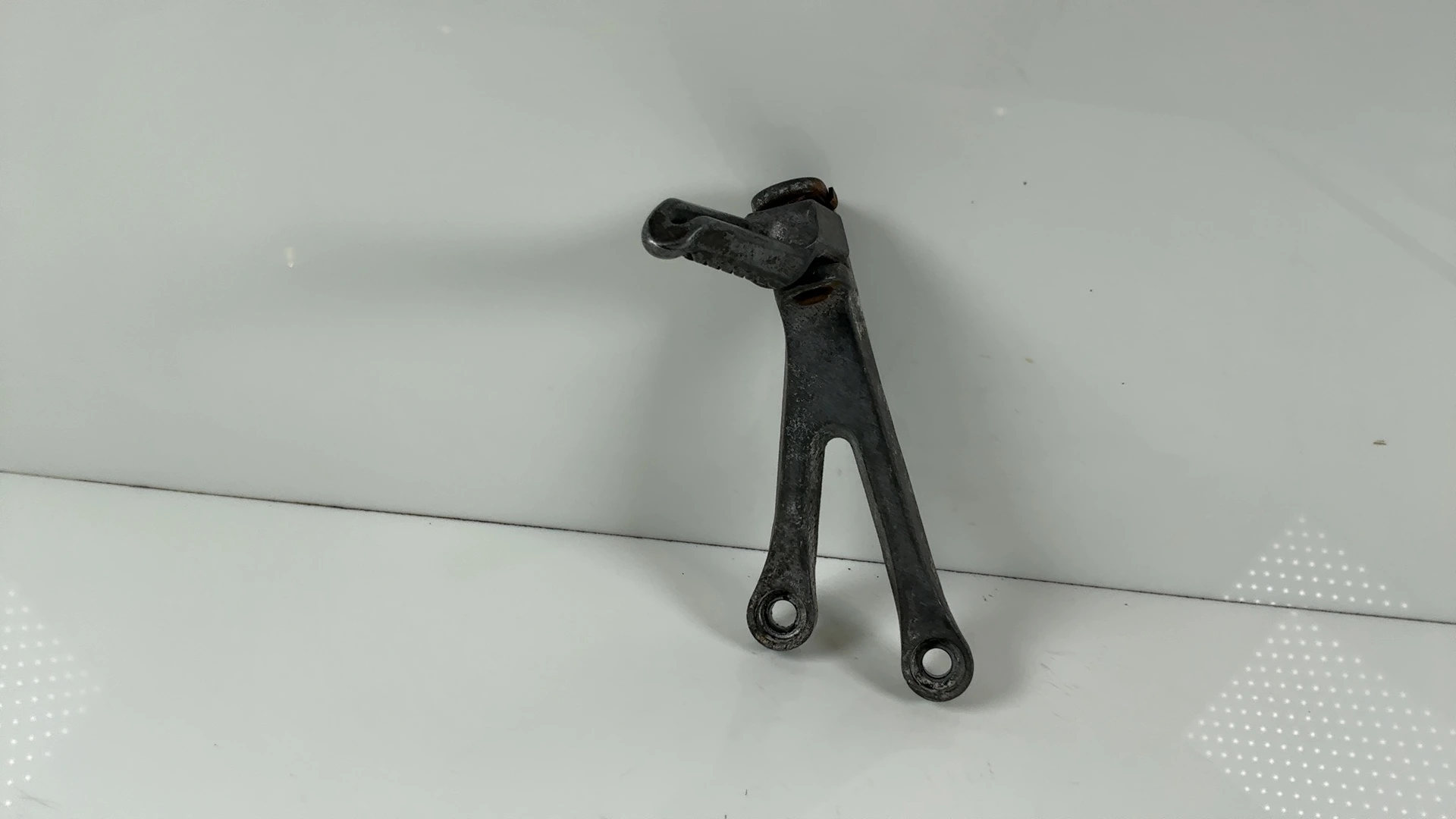 Kawasaki Ninja ZX-9R ZX900 Left Rear Footpeg Bracket 2000-2001 OEM 35011-1879-TX - Image 1