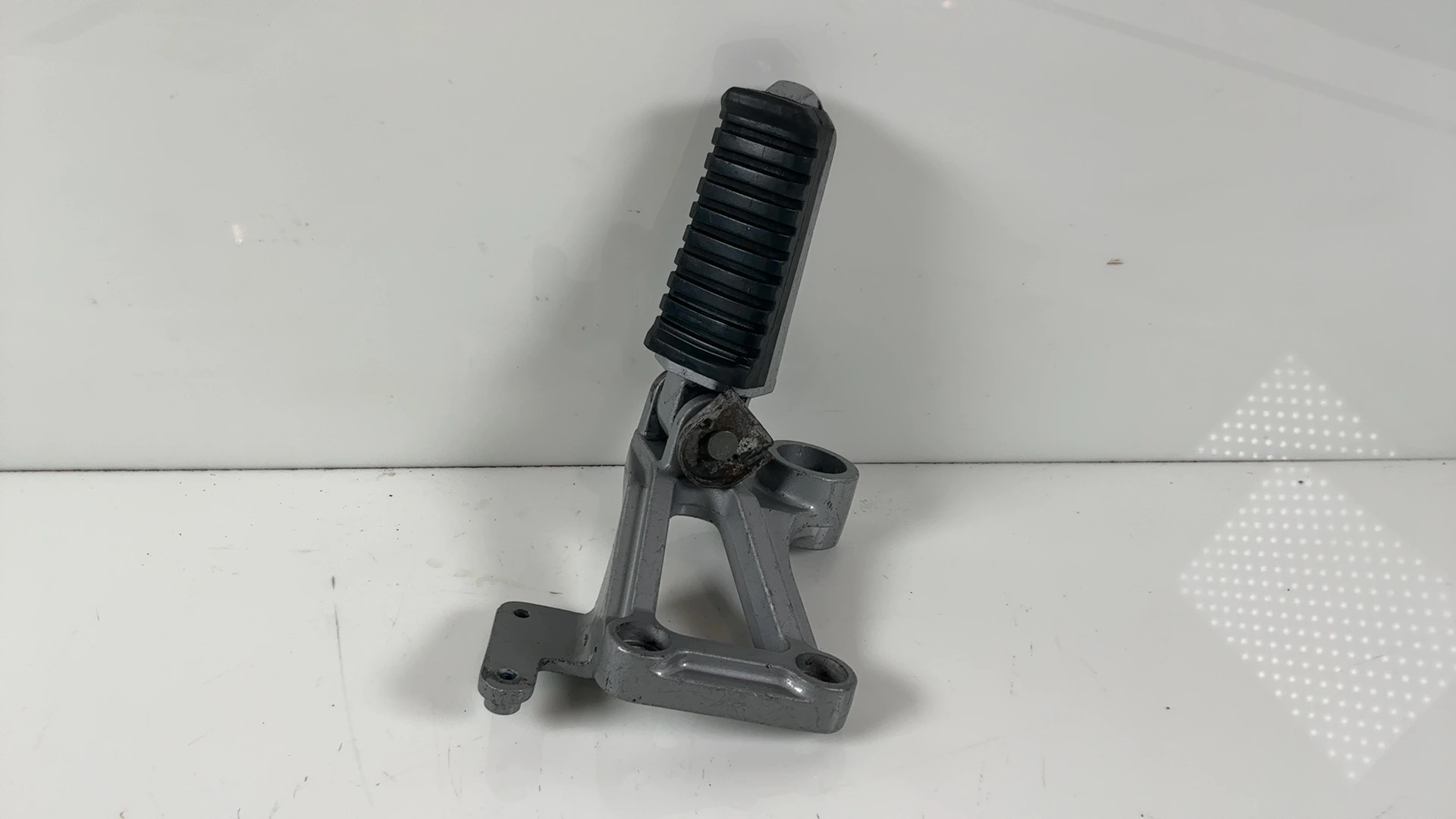 Kawasaki Ninja ZX600A 600cc Rear Left Foot Peg Bracket 1985-1987 OEM 35011-1242 - Image 1