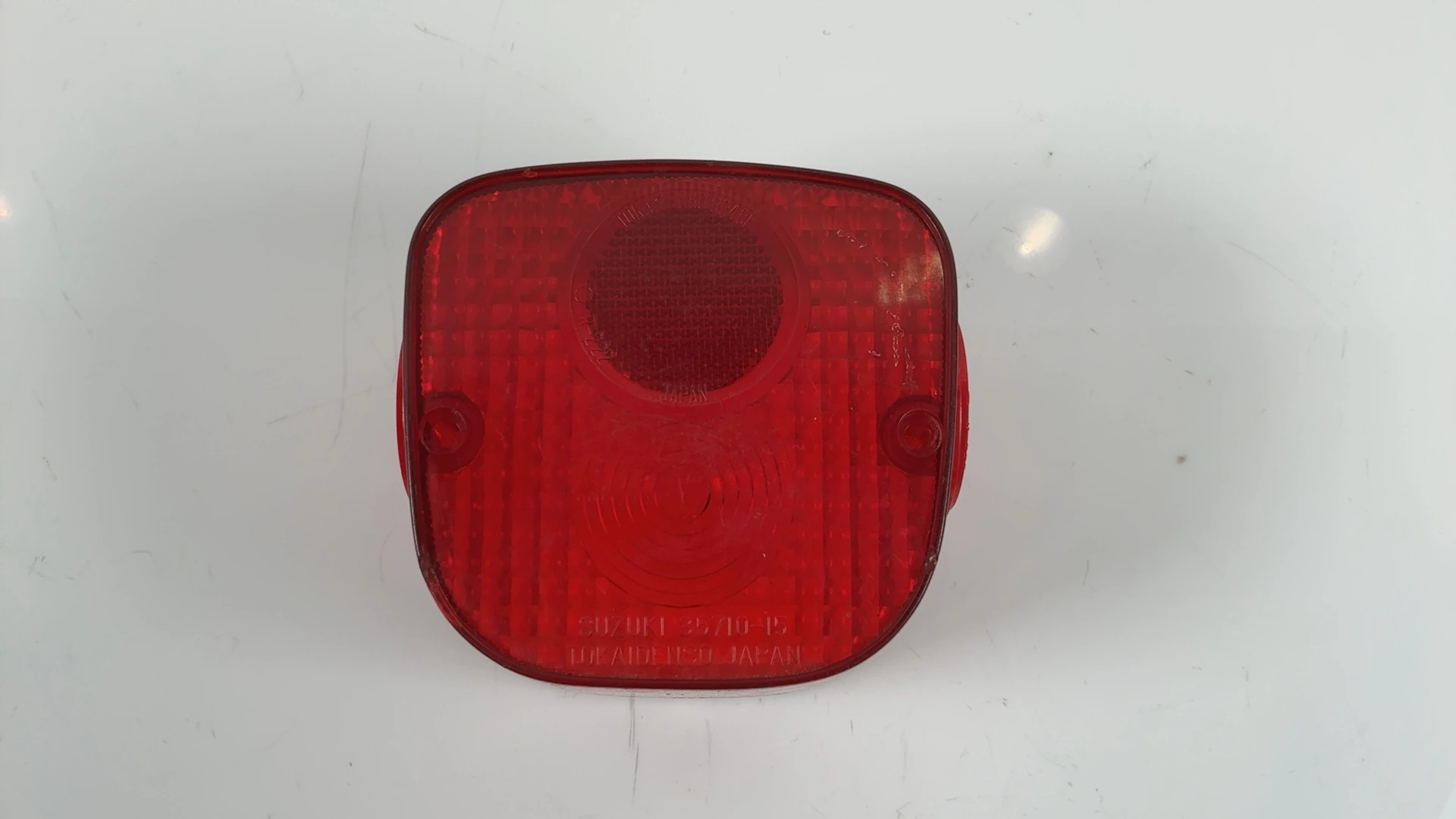 Suzuki TS125 125 Tail Light Lens 1970-1980 OEM 35712-35012 - Image 1