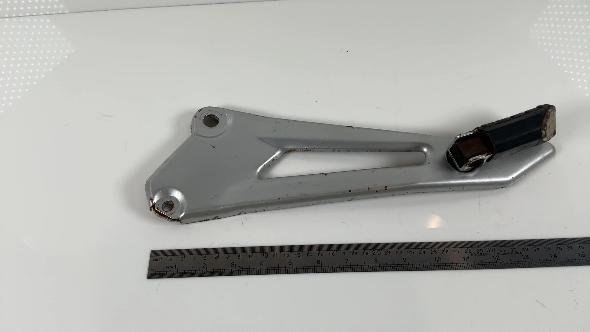 Yamaha YBR 125 YBR125 Left Rear Foot Peg Bracket Mount 2005-06 OEM 5VL-F7452-00 - Image 1