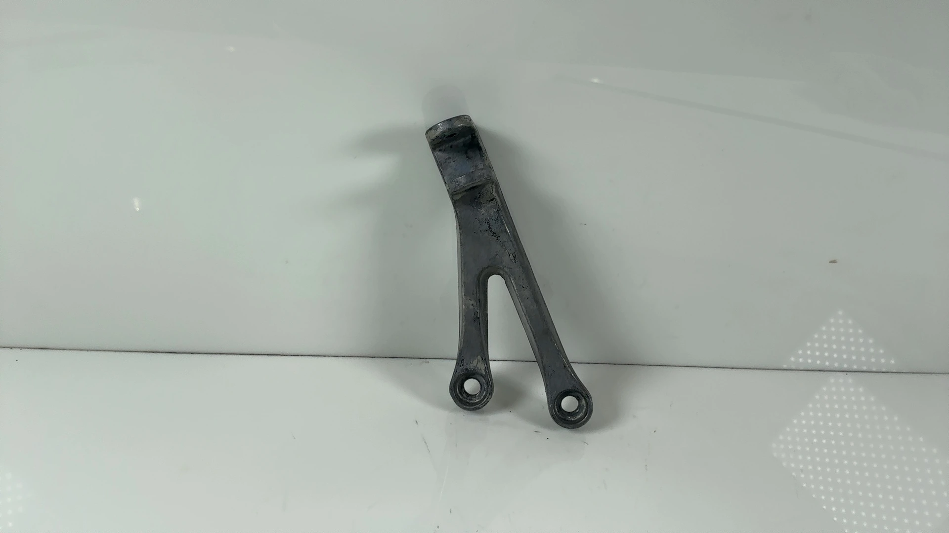 Kawasaki Ninja ZX-6R ZX600J Left Rear Footrest Bracket 2000-01 OEM 35011-1878-TX - Image 1